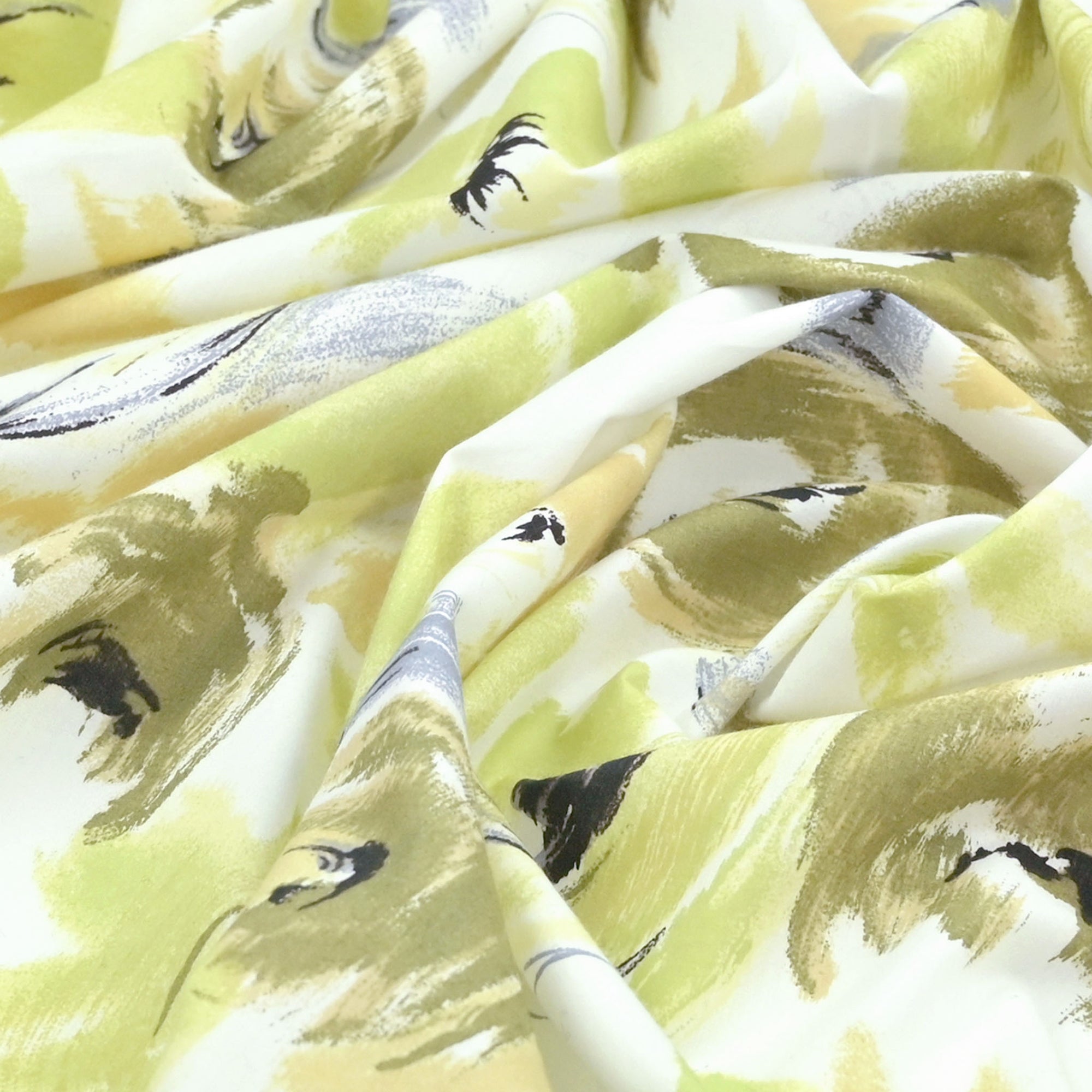 Wrinkled green fabric with floral motifs printed.