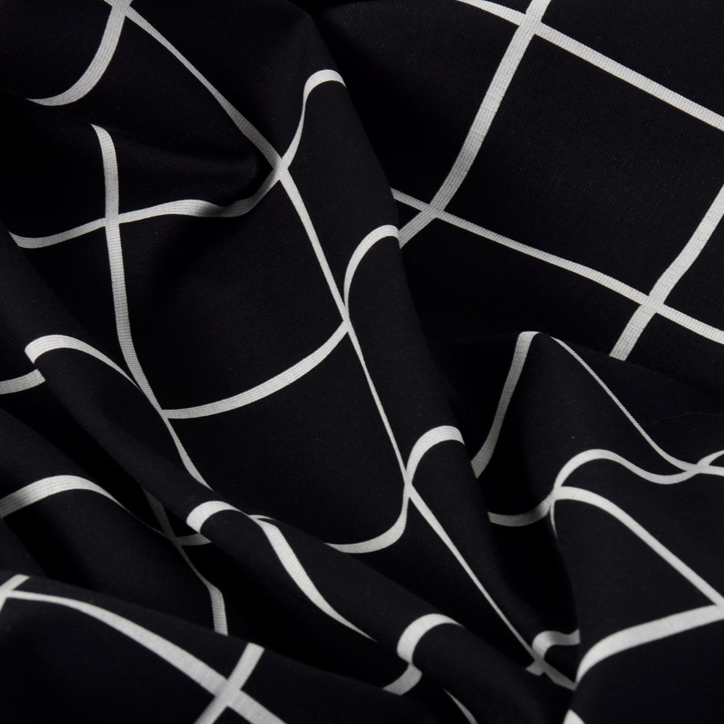 Black White Check Coating Fabric 2003 - Fabrics4Fashion